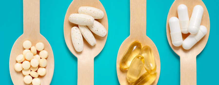 dietary supplements held in spoons | RM Warner Inernet Law Firm
