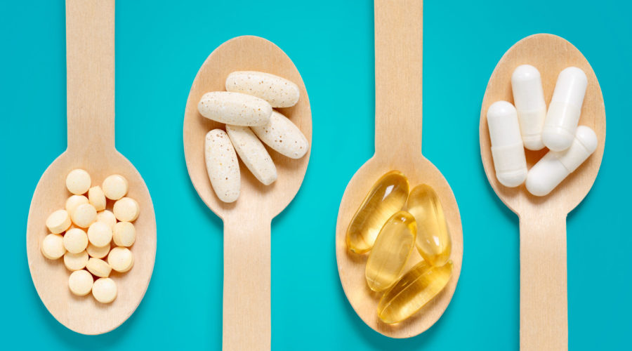dietary supplements held in spoons | RM Warner Inernet Law Firm