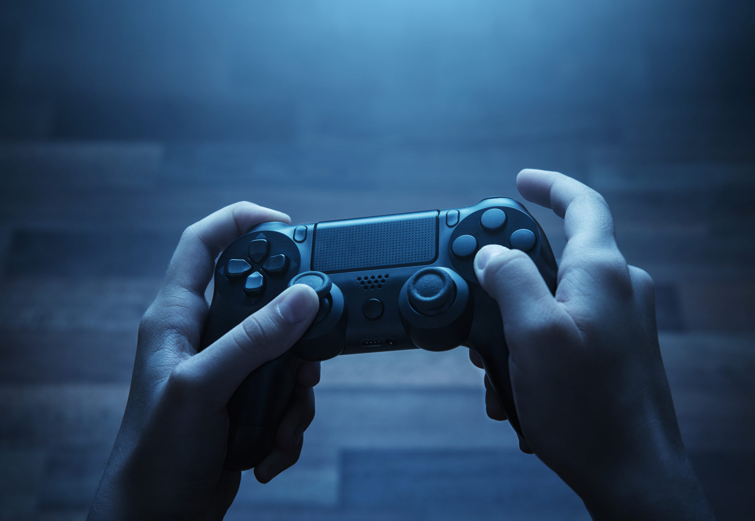 hands holding video game controller | RM Warner Internet Law Firm